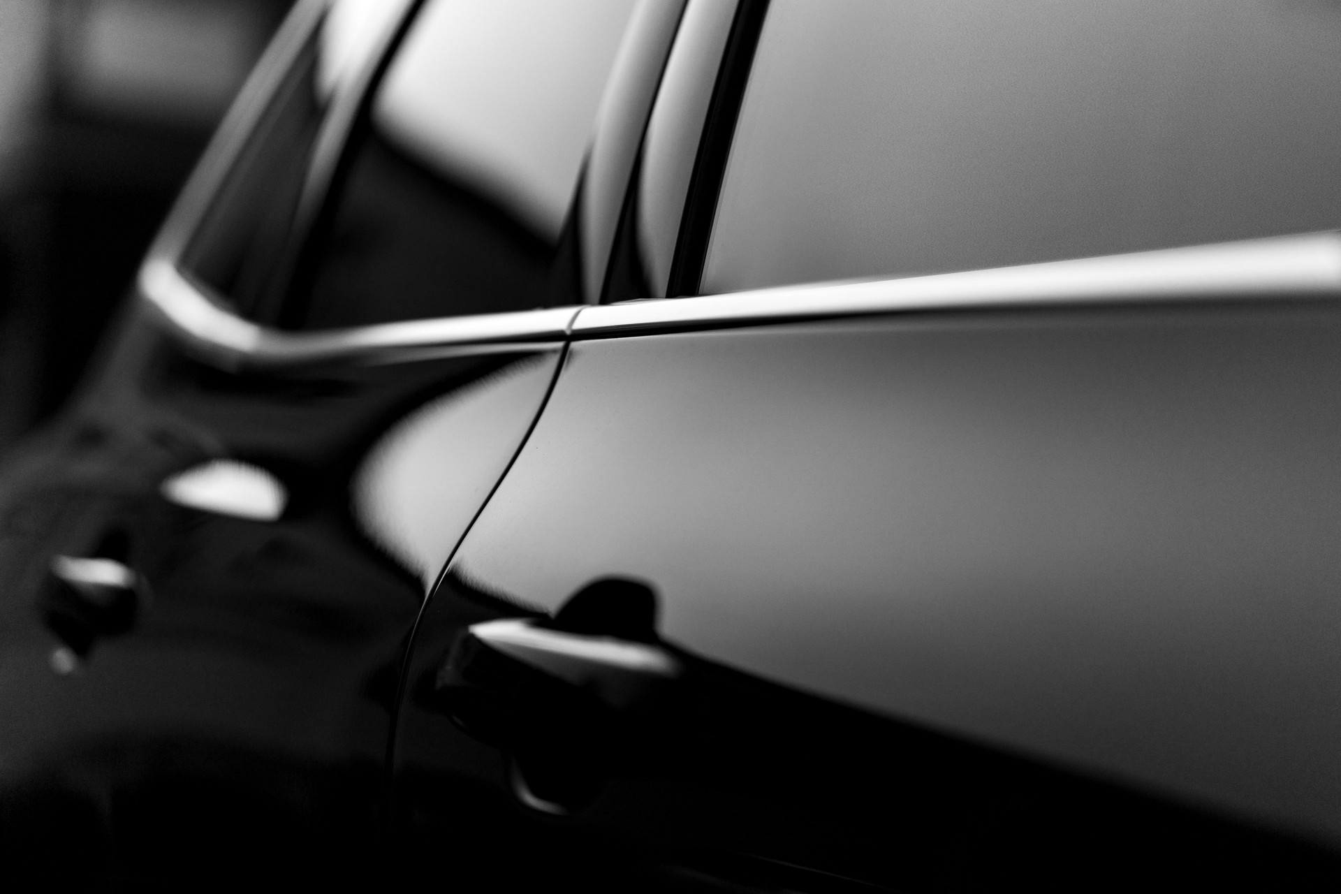 Blurred abstract black car door